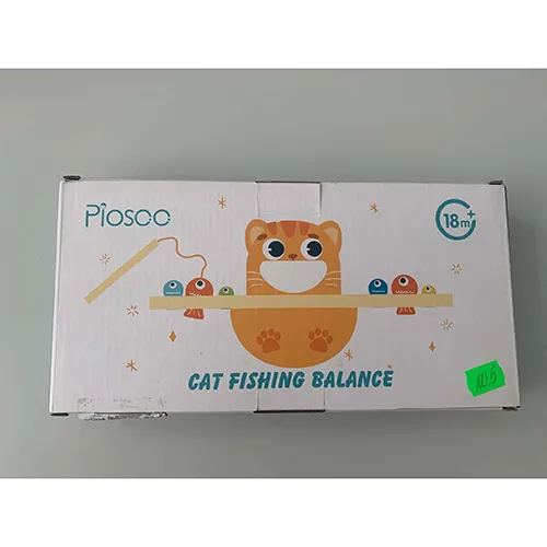 Wooden toy consisting of a cat-shaped balancing piece, a base with holes of various sizes, two fishing rods with strings and magnets, a  spoon and a colourful fish.
