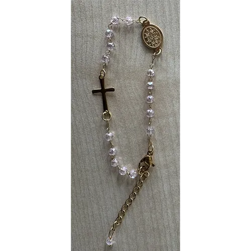 Rosary bracelet with rose-coloured beads, a round metal pendant, and a metal cross, sold in bulk.