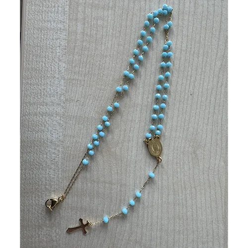 Rosary necklace with turquoise-coloured beads, a round metal pendant, and a metal cross, sold in bulk.