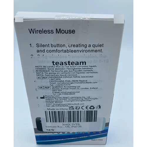 White wireless computer mouse with a USB charging cable.