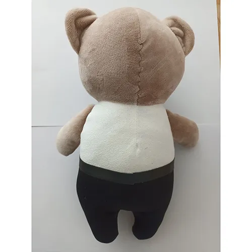 Soft stuffed toy in the shape of a bear.