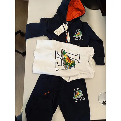 Set of a hooded sweatshirt and trousers, intended for children, size: 4 years, made of blue knitted fabric, with inscriptions