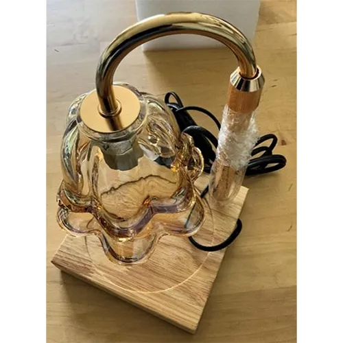 Gold-coloured lamp.