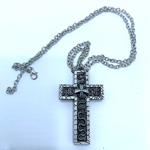 Necklace with a cross-shaped pendant featuring a hidden compartment.