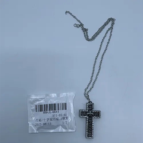 Necklace with a cross-shaped pendant featuring a hidden compartment.